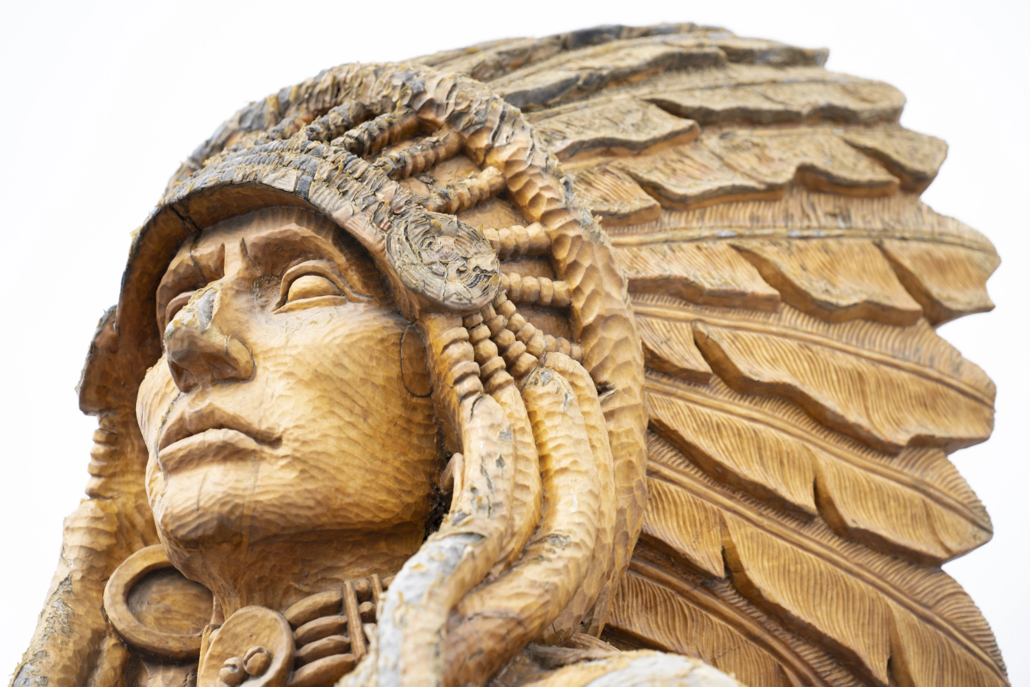 Tree sculptures by Eddie Running Wolf in Niwot, Colorado — community public art honoring Arapaho, Cheyenne and Niwot history.